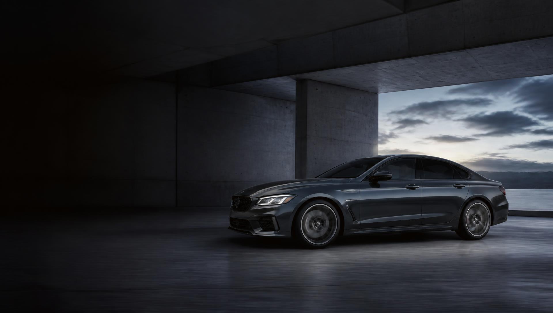 Dark graphite performance sedan in modern architecture